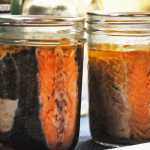 Photo by Elizabeth Earl/Peninsula Clarion Canned sockeye salmon sit on a table at the Kenai Cooperative Extension Service office on Wednesday, Aug. 31, 2016 in Soldotna, Alaska. The Cooperative Extension Service offers instruction on how to can fish at its office and in community classes.