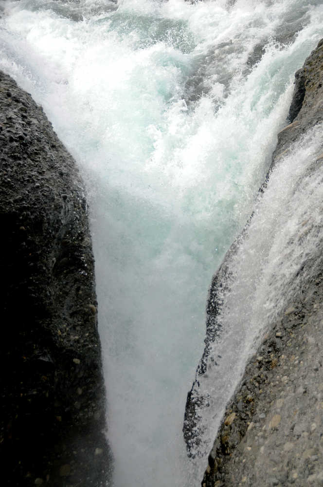 Photo by Elizabeth Earl/Peninsula Clarion A set of approximately 35-foot falls blocks fish passage into the Paint River near Cook Inlet Aquaculture Association's fish ladder, photographed Friday, Sept. 2, 2016 on the Paint River near the McNeil River State Game Sanctuary and Refuge, Alaska. Cook Inlet Aquaculture Association operates the fish ladder to allow salmon to pass into the upper reaches of the remote river system to spawn.