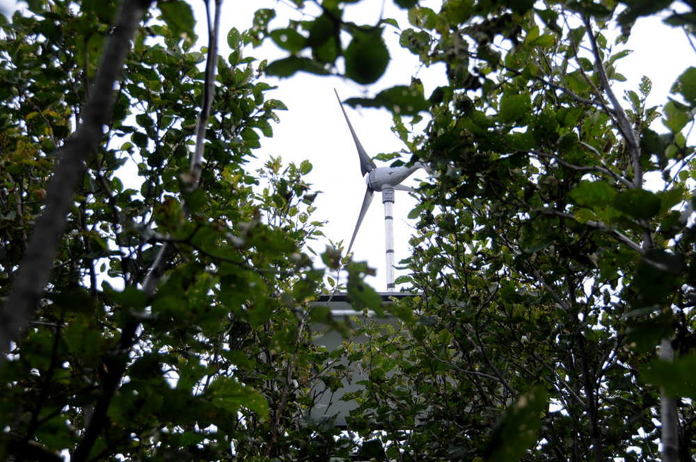 Photo by Elizabeth Earl/Peninsula Clarion A windmill attached to a solar panel powers the video weir and computer at Cook Inlet Aquaculture Association's Paint River fish ladder, photographed Friday, Sept. 2, 2016 near the McNeil River State Game Sanctuary and Refuge, Alaska. Cook Inlet Aquaculture Association operates the fish ladder to allow salmon to pass into the upper reaches of the remote river system to spawn.