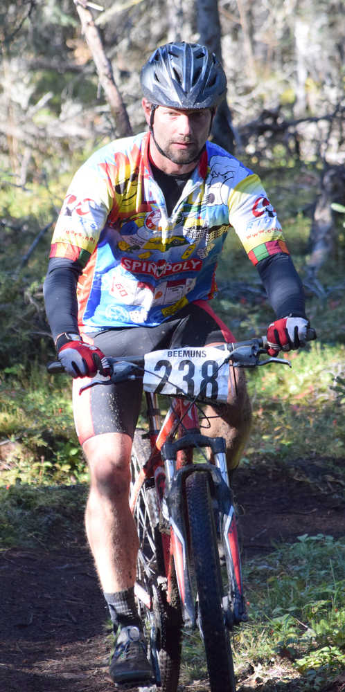 Photo by Jeff Helminiak/Peninsula Clarion Tony Eskelin negotiates the Mosquito singletrack Saturday at Tsalteshi Trails during Psychocross.