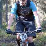 Photo by Jeff Helminiak/Peninsula Clarion Overall winner Nathan Kincaid finishes off a section of Mosquito singletrack Saturday at Tsalteshi Trails during Psychocross.