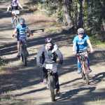 Photo by Jeff Helminiak/Peninsula Clarion Carl Kincaid leads Ashley Tonione, Dylan Hogue and Landen Showalter down the beginning of the Goat loop Saturday at Tsalteshi Trails during Psychocross.