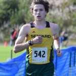 Photo by Jeff Helminiak/Peninsula Clarion Seward senior Hunter Kratz finishes off his second straight Kenai Peninsula Borough boys cross-country title Tuesday in Seward.