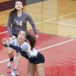 Soldotna junior Cally Christianson keeps play alive with a dig near the sideline during a 3-0 loss to Wasilla at Wasilla High School Thursday.