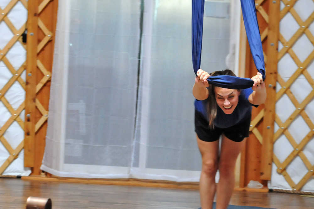 Photo by Elizabeth Earl/Peninsula Clarion A participant strikes a pose during an aerial yoga session at the Yoga Yurt on Monday, Sept. 12, 2016 near Soldotna, Alaska. The Yoga Yurt, a new yoga studio on Kalifornsky Beach Road near the intersection of Poppy Lane, opened this summer, offering aerial and paddleboard yoga as well as more traditional mat yoga classes.