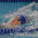Photo by Joey Klecka/Peninsula Clarion Kodiak's Marina Cummiskey works her way to the victory in the girls 50-yard backstroke Friday at the SoHi Pentathlon in Soldotna. Cummiskey claimed the overall victory in the event.