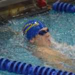 Photo by Joey Klecka/Peninsula Clarion Kodiak junior Talon Lindquist touches the wall at the end of the boys 50-yard breaststroke Friday at the SoHi Pentathlon in Soldotna. Lindquist won the title and broke a longtime record in the process.
