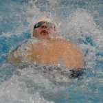 Photo by Joey Klecka/Peninsula Clarion Soldotna senior Cody Watkins backstrokes in the boys 50-yard IM Friday at the SoHi Pentathlon in Soldotna.