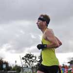 Photo by Elizabeth Earl/Peninsula Clarion John Hellen of Anchorage heads down the home stretch toward the finish line to take first place in the Kenai River Marathon on Sunday, Sept. 25, 2016 in Kenai, Alaska. Hellen, who finished with a time of 3:08:04, will use his finishing time in the Kenai River Marathon when entering the Comrades Marathon in South Africa, the world's oldest and largest ultramarathon, next summer.
