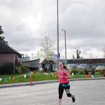 Photo by Elizabeth Earl/Peninsula Clarion Derek Gibson of Soldotna takes a deep breath as he crosses the finish line after running the half-marathon event in the Kenai River Marathon on Sunday, Sept. 25, 2016 in Kenai, Alaska. Gibson took first place in the half-marathon event with a time of 1:16:54, more than 16 minutes ahead of the second-place finisher.