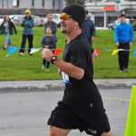 Photo by Elizabeth Earl/Peninsula Clarion Ken Felchle of Soldotna closes in on the finish line at the Kenai River Marathon on Sunday, Sept. 25, 2016 in Kenai, Alaska. Felchle finished third in the full marathon race with a time of 3:17:09.