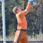 Photo by Joey Klecka/Peninsula Clarion Cook Inlet Academy senior goalkeeper Brady Hammond gets his mitts on a ball early in Thursday's action at the Aurora Borealis Conference tournament at the Kenai Sports Complex fields.