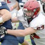 Photo by Jeff Helminiak/Peninsula Clarion Kenai's Seth Kruse hauls down Soldotna's Jace Urban on Saturday at Justin Maile Field in Soldotna.