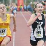 Photo by Joey Klecka/Peninsula Clarion Kenai Central's Jaycie Calvert (601) sprints to the finish with West Valley's Maggie Druckenmille in Saturday's 4A girls race at the Bartlett High School trails in Anchorage.