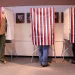 Photo by Megan Pacer/Peninsula Clarion Soldotna residents cast their votes during the municipal election Tuesday, Oct. 4, 2016 at Soldotna City Hall in Soldotna, Alaska. The city's proposed home-rule charter passed, and four unopposed city council candidates were elected.