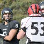 Photo by Joey Klecka/Peninsula Clarion Nikiski quarterback Ian Johnson (8) looks for a receiver in a Sept. 24 game against Eielson at Nikiski High School. The two teams will meet again this weekend for a small-schools playoff semifinal matchup in Fairbanks.