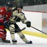 Photo by Jeff Helminiak/Peninsula Clarion Kenai River defenseman Shayne Monahan tries to keep Johnstown (Pennsylvania) forward Mitchell Hale away from the puck Friday at the Soldotna Regional Sports Complex.