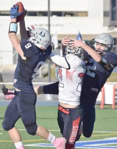 Photo by Joey Klecka/Peninsula Clarion Soldotna cornerback Jace Urban (9) intercepts a pass from North Pole quarterback Craig Borba late in Saturday's medium-schools semifinal at Palmer High School.