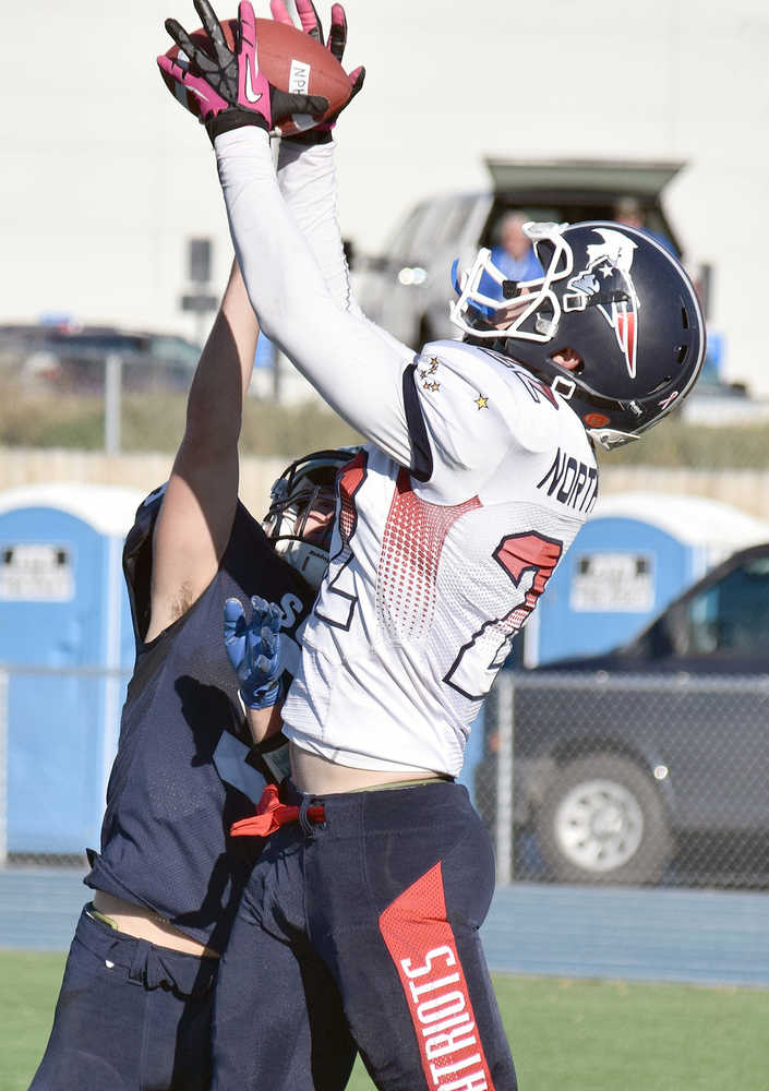 Photo by Joey Klecka/Peninsula Clarion Soldotna cornerback Jace Urban tries to cover a catch by North Pole receiver Jeremiah Howe in the second half of Saturday's medium-schools semifinal at Palmer High School.