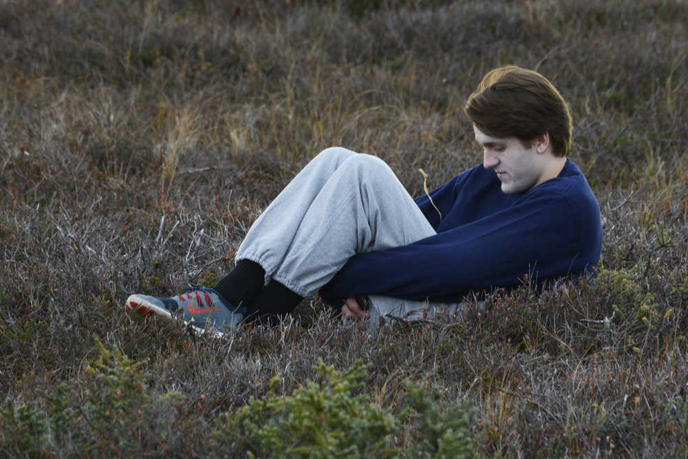 Photo by Megan Pacer/Peninsula Clarion A volunteer lies on the ground posing as a victim of a plane crash during during a mass casualty drill Tuesday, Oct. 11, 2016 at the Kenai Municipal Airport in Kenai, Alaska. The airport is required by the Federal Aviation Administration to hold the drill every three years to test its emergency planning.