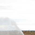 Photo by Megan Pacer/Peninsula Clarion Kenai Fire Battalion Chief Tony Prior and a firefighter help volunteer Sloan Young, who is visiting Alaska from Orlando, Florida, onto a stretcher during a mass casualty drill Tuesday, Oct. 11, 2016 at the Kenai Municipal Airport in Kenai, Alaska. Young joined more than 30 volunteers who posed as crash victims during the drill which the airport is required by the Federal Aviation Administration to hold every three years to test its emergency planning.