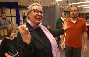 Ben Boettger/Peninsula Clarion Terri Zopf-Shoessler, in the role of playwright Olivia Davis-Bascombe, expounds her idea for a murder mystery to skeptical cast members (left to right) Daniel Rozak, Terri Burdick, Ian McEwen, and Jamie Nelson during a dress rehearsal of Mike Druce's dinner theater production "The Show Can't Go On (But it must)" on Wednesday, Oct. 12 at the Kenai Senior Center.