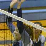 Photo by Jeff Helminiak/Peninsula Clarion Soldotna's Drewe Zeek attempts a block while Cally Christianson backs her up against Colony on Wednesday at Soldotna High School.