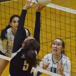 Photo by Joey Klecka/Peninsula Clarion Nikiski senior Maddy Williams (13) eyes the ball against Houston middle hitter Cassie Kapuniai (5) Thursday evening at Nikiski High School.