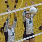 Photo by Joey Klecka/Peninsula Clarion Nikiski seniors Maddy Williams (13) and Ayla Pitt work together to block a Houston shot Thursday evening at Nikiski High School.