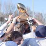 Photo by Joey Klecka/Peninsula Clarion Soldotna players hoist the medium-schools state football championship trophy following a 49-13 win over Palmer, Saturday at Palmer High School.
