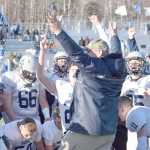 Photo by Joey Klecka/Peninsula Clarion Soldotna coach Galen Brantley Jr. celebrates with his players after winning a school-record fifth straight state football championship Saturday afternoon at Palmer High School.