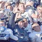 Photo by Joey Klecka/Peninsula Clarion Soldotna head coach Galen Brantley Jr. (center with dark jacket) celebrates with his players after winning a school-record fifth straight state football championship Saturday at Palmer High School. The Stars defeated the Palmer Moose 49-13.