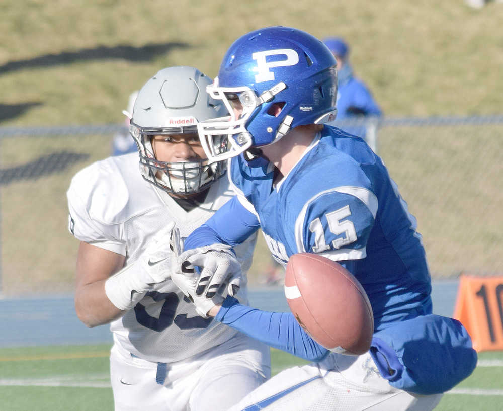 Photo by Joey Klecka/Peninsula Clarion Soldotna linebacker Wendell Tuisaula eyes Palmer reciever Skyler Hale (15) in the second half of Saturday's medium-schools state championship at Palmer High School.