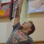 Photo by Joey Klecka/Peninsula Clarion Nikiski senior Michael Meyers reaches high in the vertical jump challenge Wednesday night at Kenai Central High School.