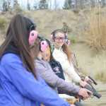 Photo by Megan Pacer/Peninsula Clarion Matthea Boatright, 16, smiles down the line as she and other members of this year's Teens on Target program prepare for a drill to practice shooting handguns Thursday, Oct. 20, 2016 at the Snowshoe Gun Club Range in Kenai, Alaska.