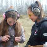 Photo by Megan Pacer/Peninsula Clarion Morgan Reynolds, left, and Faith Glassmaker check a magazine while they load it along with other members of this year's Teens on Target program Thursday, Oct. 20, 2016 at the Snowshoe Gun Club Range in Kenai, Alaska.