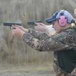Photo by Megan Pacer/Peninsula Clarion Erin Hoogenboom, 14, shoots a hand gun at a target during a meeting of this year's Teens on Target program Thursday, Oct. 20, 2016 at the Snowshoe Gun Club Range in Kenai, Alaska.