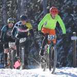 Photo by Joey Klecka/Peninsula Clarion Tyle Owens (394) leads Jacque Drumm (396) and Nathan Kincaid over a hill midway through the course Saturday afternoon at the Tsalteshi Trails.