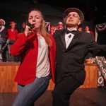 Photo by Ben Boettger/Peninsula Clarion Hannah Tauriainen and Joe Rizzo open up the Triumvirate Theatre's "Lame Ducks and Dark Horses" political satire play with a song backed by a chorus line during a dress rehearsal Monday, Oct. 24, 2016 near Kenai, Alaska.