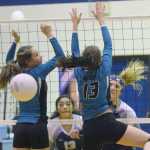 Photo by Joey Klecka/Peninsula Clarion Soldotna middle hitter Drewe Zeek hits a ball by Nikiski blocking duo Rylee Jackson and Maddy Williams (13) Saturday afternoon at Soldotna High School.