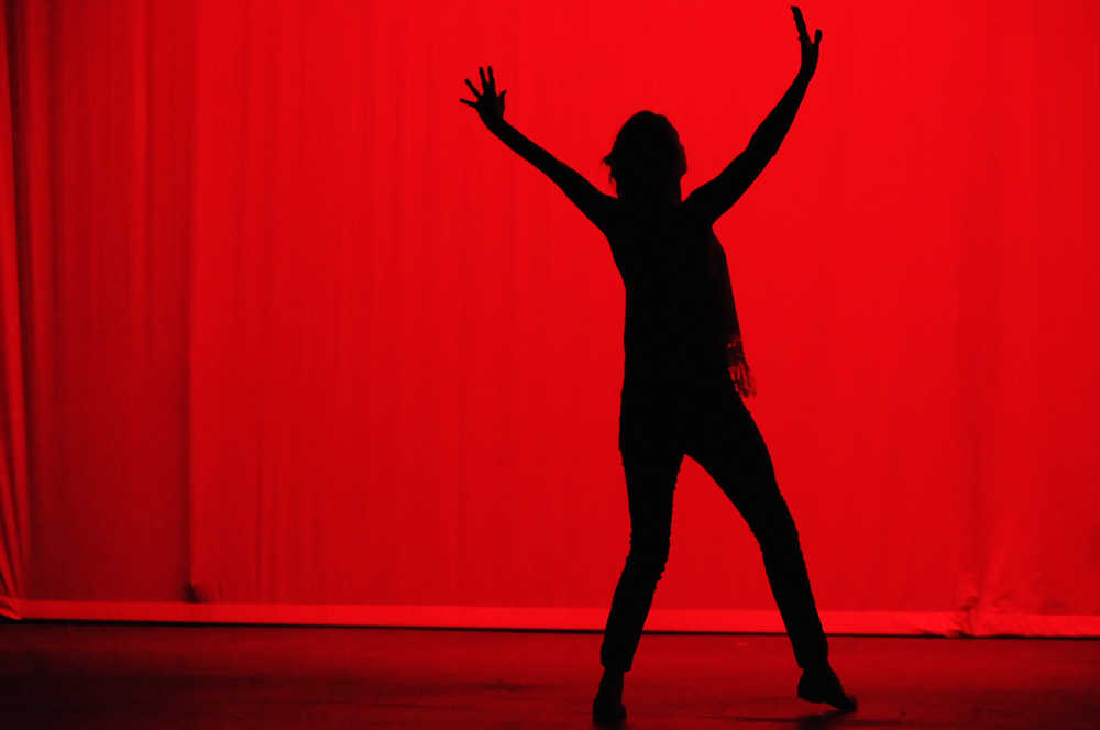 Photo by Elizabeth Earl/Peninsula Clarion A dancer from Peninsula Artists in Motion, a central Kenai Peninsula dance group, rehearses Wednesday, Nov. 2, 2016 at Kenai Central High School in Kenai, Alaska. The group will perform Friday, Nov. 4, 2016 at the high school at 7 p.m. to mark its 15th anniversary.