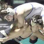 South Anchorage's Micah Ee takes a shot on Gideon Hutchison during the 113-pound final of the Colony Invitational Saturday in Palmer. Hutchison won the match by injury default.