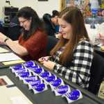 Photo by Megan Pacer/Peninsula Clarion Hannah Titus, right, and her mother, Jodie Titus, the elections chair for the Salamatof precinct, help the election run smoothly as voters file in Tuesday, Nov. 8, 2016 at the Nikiski Fire Station No. 1 in Nikiski, Alaska.