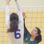 Photo by Joey Klecka/Peninsula Clarion Seward setter Ashley Jackson sends a ball into the clutches of Barrow's Ana Stringer, Thursday morning at the Class 3A state volleyball tournament at the Alaska Airlines Arena in Anchorage.
