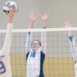 Photo by Joey Klecka/Peninsula Clarion Nikiski middle hitters Ayla Pitt (10) and Jamie Yerkes work together to block a shot from Monroe Catholic opposite hitter Jordyn Sager, Thursday morning at the Class 3A state volleyball tournament at the Alaska Airlines Arena in Anchorage.
