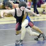 Photo by Jeff Helminiak/Peninsula Clarion Soldotna's Talon Musgrave tries to escape from Kenai Central's Keyshawn McEnerney on Thursday at Soldotna Prep. McEnerney won by major decision in the 160-pound match.
