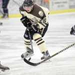 Photo by Jeff Helminiak/Peninsula Clarion Kenai River forward Jonathan Marzec looks for a hole in the Janesville (Wisconsin) Jets defense Friday at the Soldotna Regional Sports Complex.