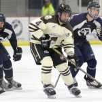 Photo by Jeff Helminiak/Peninsula Clarion Kenai River's Matthew Thielemann looks to make a play as he crosses center ice Friday at the Soldotna Regional Sports Complex.