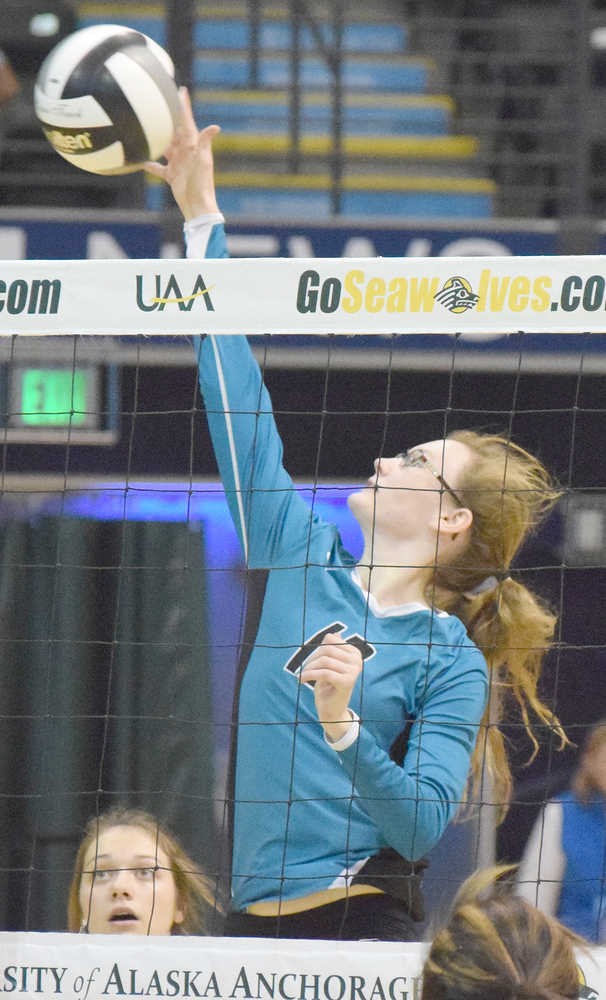 Photo by Joey Klecka/Peninsula Clarion Nikiski's Melanie Sexton sends a ball over the netting against Mt. Edgecumbe, Friday evening at the Class 3A state volleyball tournament held at the Alaska Airlines Arena in Anchorage.