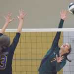 Photo by Joey Klecka/Peninsula Clarion Seward's Coral Petrosius (7) sends the ball across the net Friday against Monroe Catholic's Chloe Maynard at the Class 3A state volleyball tournament held at the Alaska Airlines Arena in Anchorage.